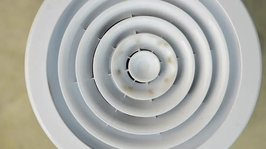Round white ceiling air vent seen from below