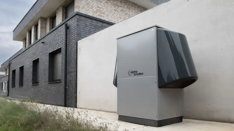 Innovative heat pump system by alpha innotec installed outside a contemporary building