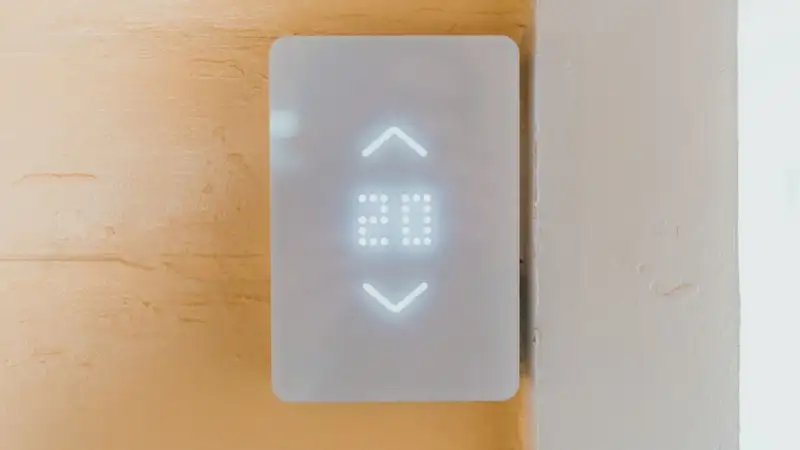 Close-up of a contemporary elevator call panel featuring a bright LED number display